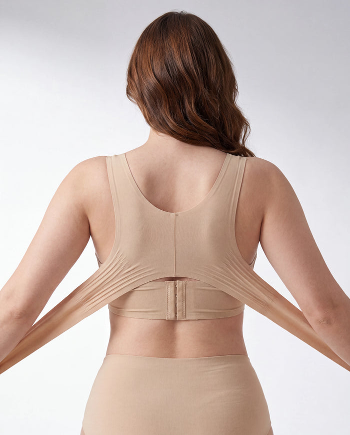 The elastic side wings stretch wide before crossing over your back